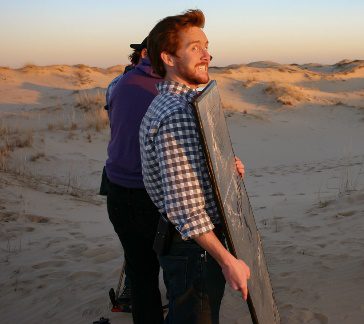 A person standing on a beachDescription automatically generated